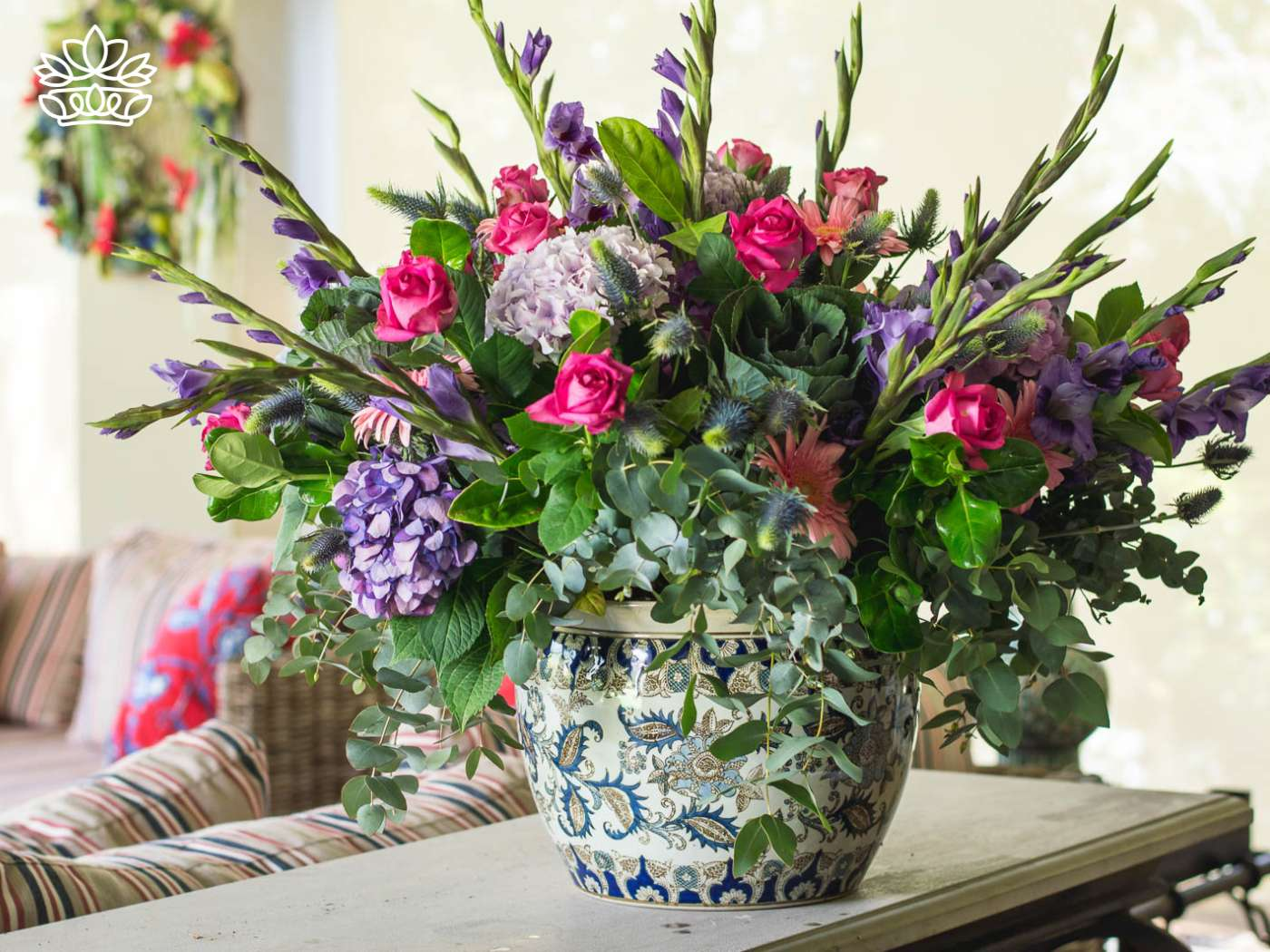 Opulent arrangement of roses and hydrangeas in a classic vase, reflecting the same-day delivery service of gifts by experienced florists for nationwide delivery, from Fabulous Flowers and Gifts.