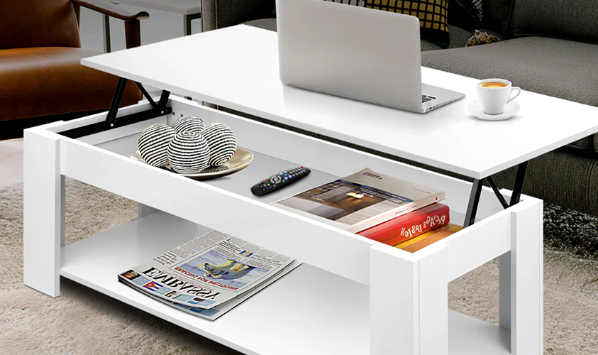 An Artiss white lift-top coffee table has been converted into a home desk, with the existing tabletop decor shifted to the storage space inside.