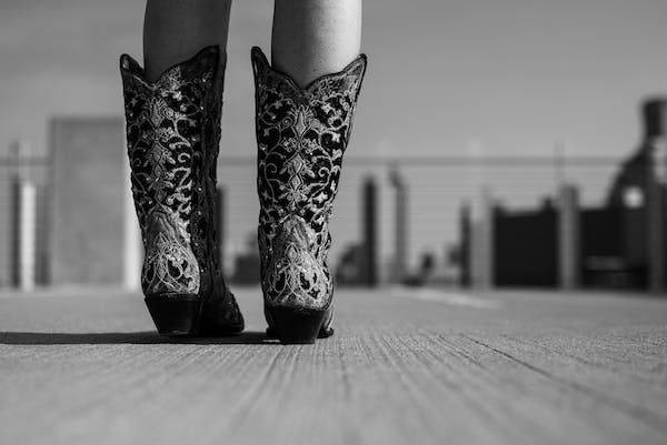 Black and white photo of cowboy botts