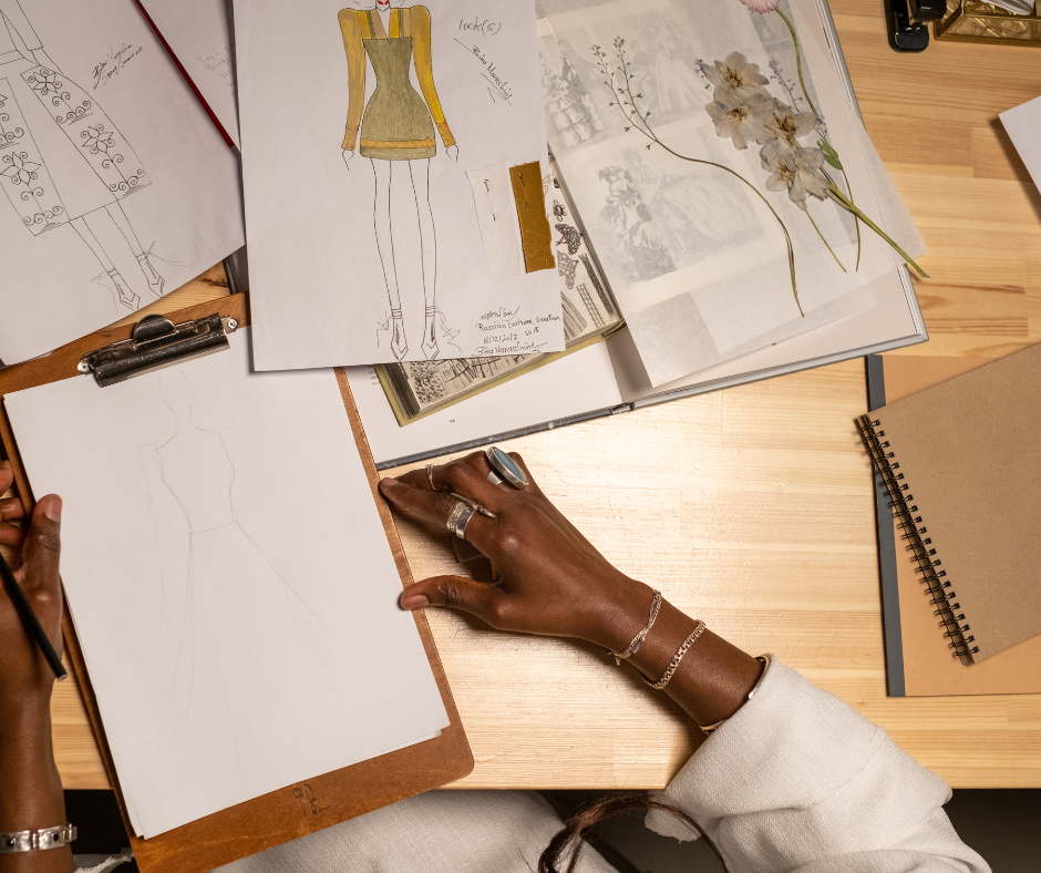 two fashion brands as collaboration partners with a woman looking over sketches and mood boards