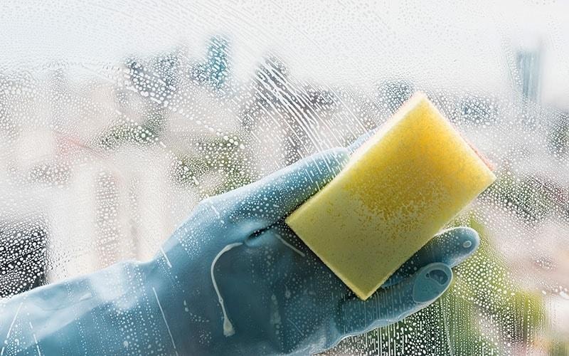 Soapy sponge window cleaning