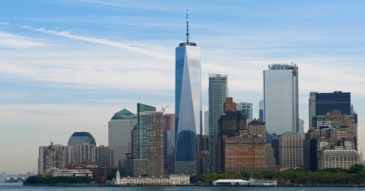 A photograph of Lower Manhattan, featuring the city skyline with skyscrapers and the One World Trade Center visible in the background. The image conveys the idea of a bustling city full of life and activity. The image suggests that online Gottman Method Couples Therapy can be a convenient and accessible option for couples in the busy city of New York, allowing them to receive therapy from the comfort of their own home or office while still taking advantage of the services provided by certified therapists in the city.