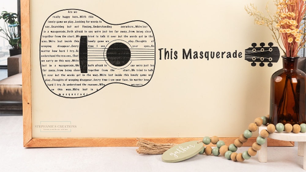 custom engraved wooden wall art featuring an acoustic guitar and the text This Masqueade 