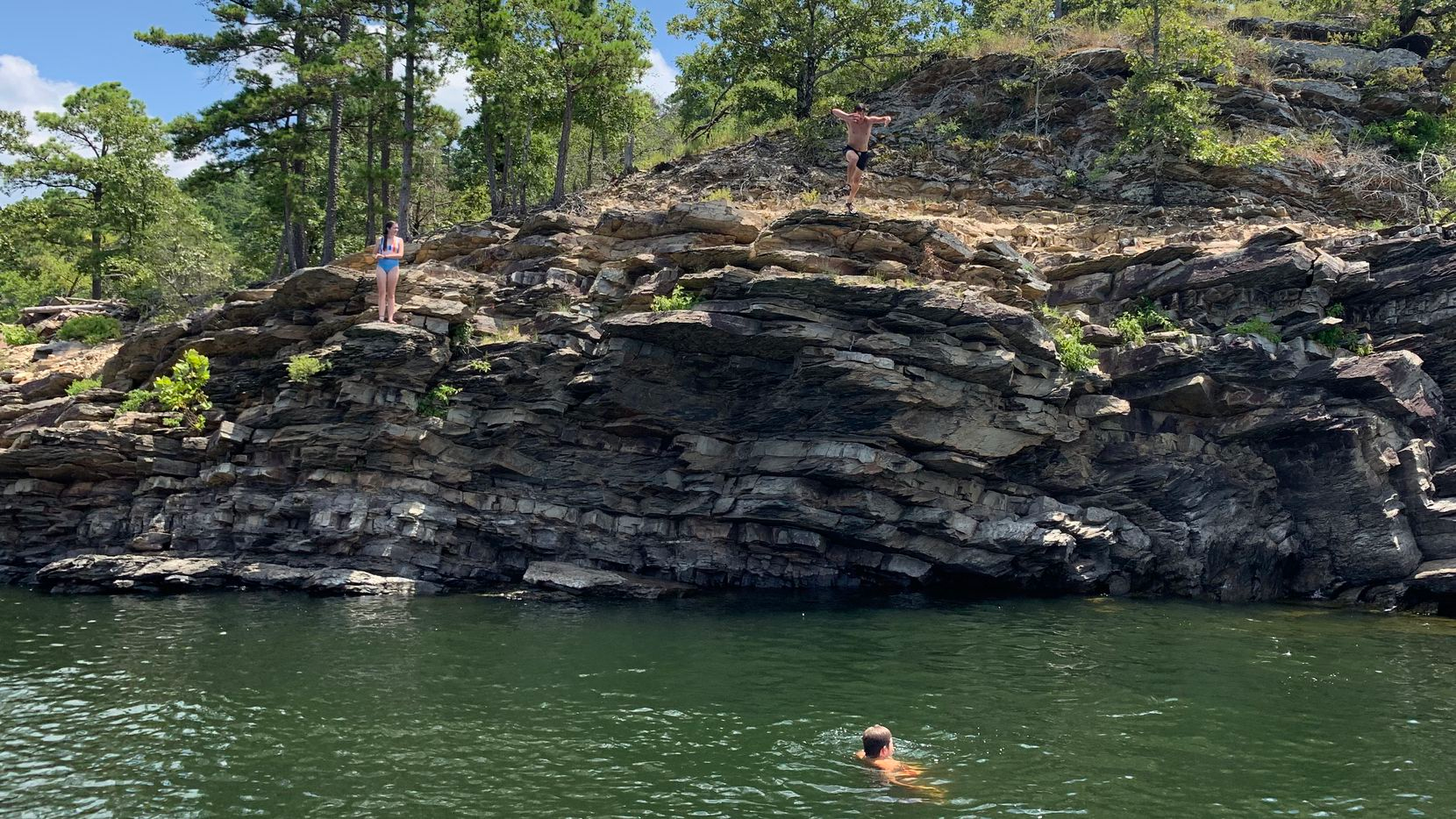 Kids jumping into the lake