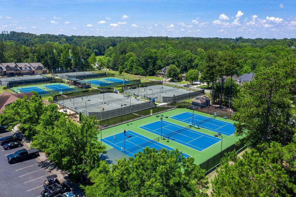 playing tennis at the Bridgemill Community Association courts in Canton, Georgia. Townsend Realty Group