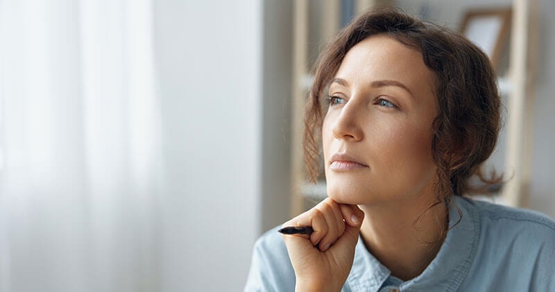 A woman pausing to think through the day ahead.