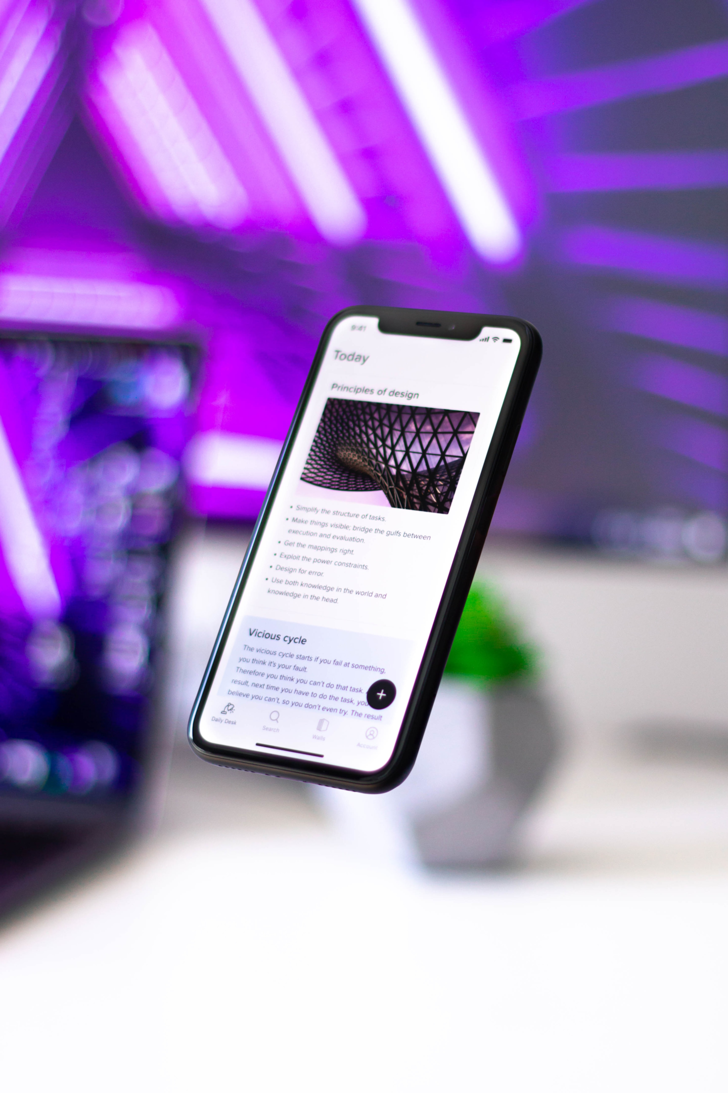 A phone with the text "Principles of design"