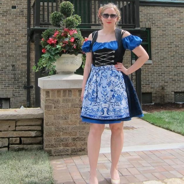 Rare Dirndl black dress designed with blue blouse and apron for women
