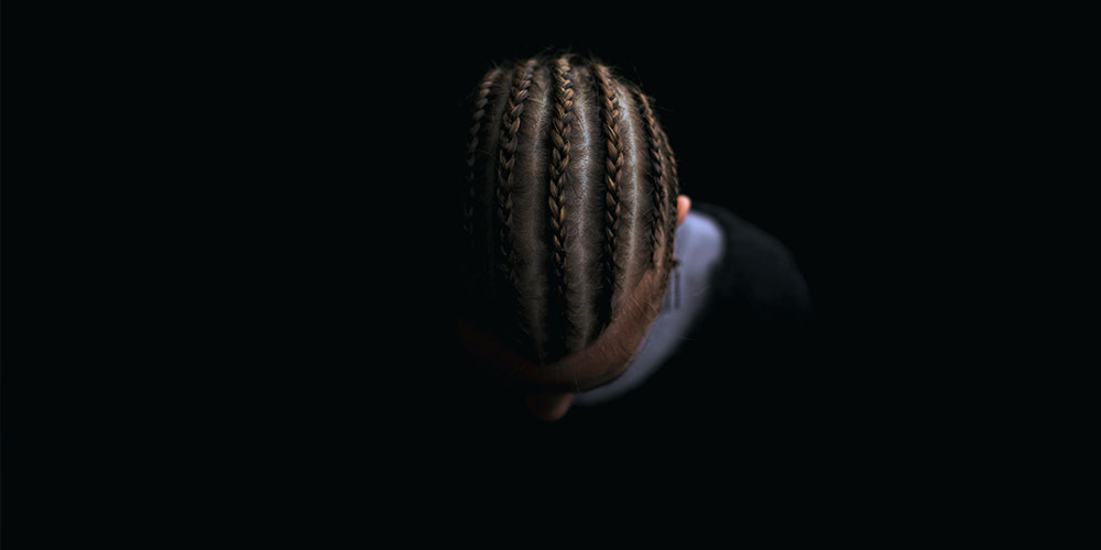 over head shot of man with cornrows and wondering how long they last