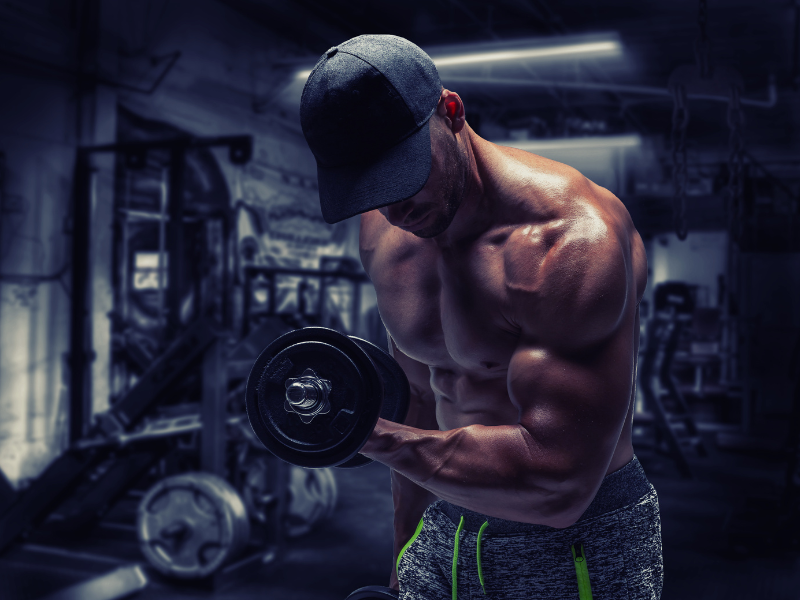 Image showing a man getting a large muscle pump after taking pre-workout supplements to improve blood flow.