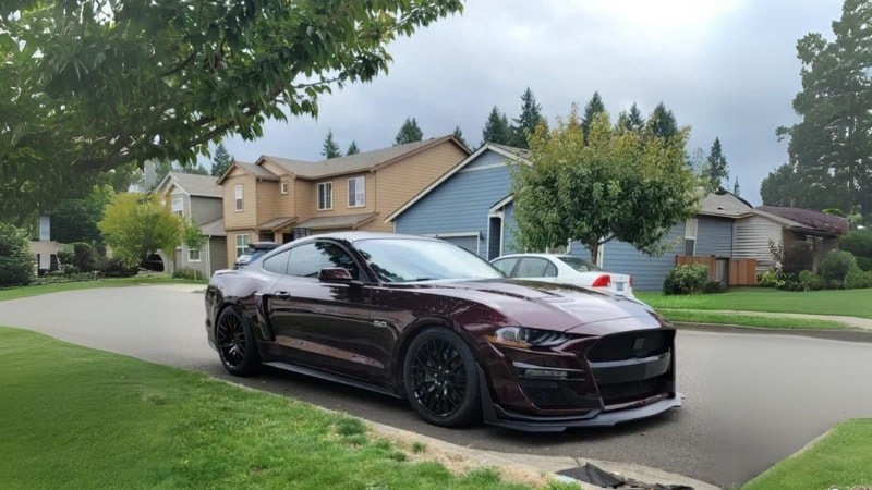 A Mustang wrapped in purple vinyl wrap