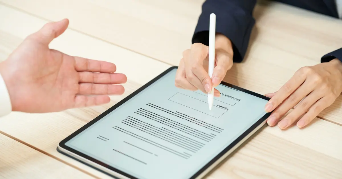 OnlyFans reviewing a contract and payment details when paying international contractors.