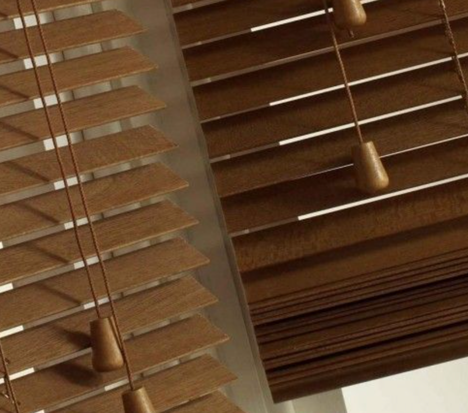 In an elegant upper-class home, wooden venetian blinds are elegantly installed on large windows, showcasing a blend of style and functionality. These eco-friendly window treatments enhance indoor air quality while providing light filtering and energy efficiency, contributing to tremendous energy savings and a sustainable environment.
