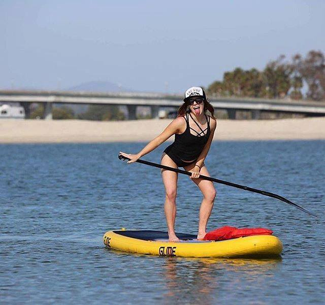 woman on inflatable stand up paddle board