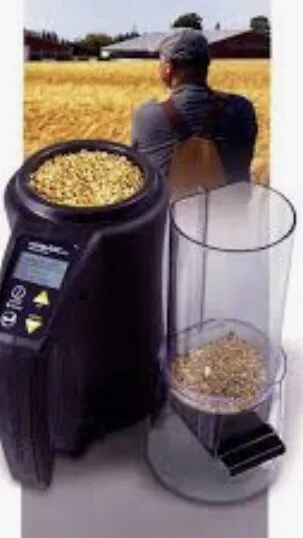 A grain moisture tester in use