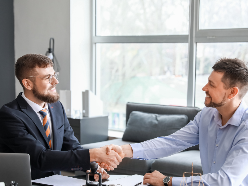 Image of a lawyer meeting with a client in Raleigh, NC.