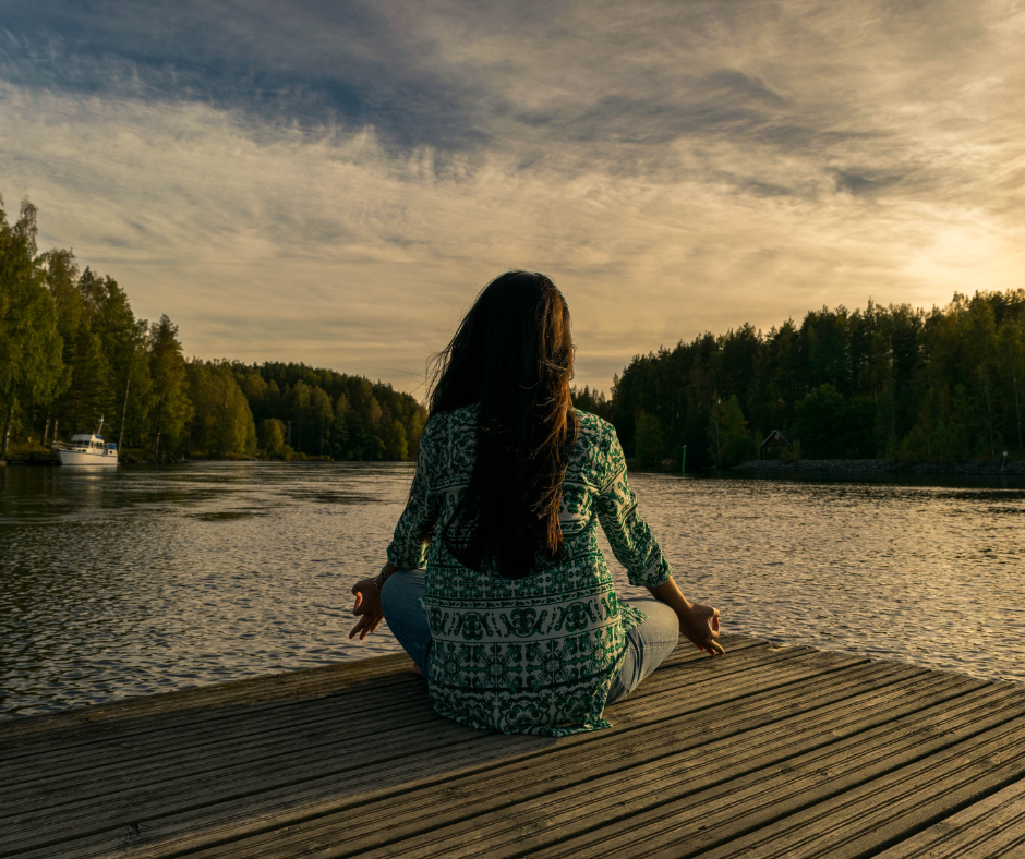 A person meditating in a peaceful environment