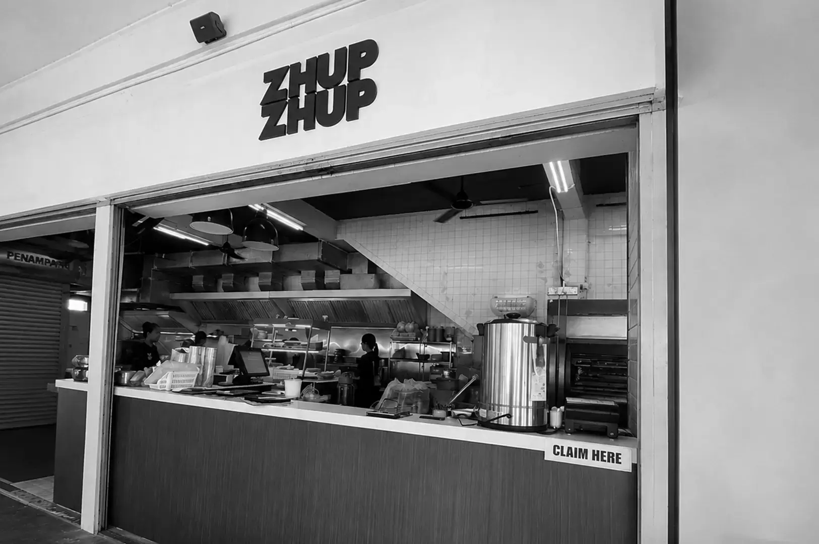 Front counter of Zhup Zhup with its open kitchen and service area.
