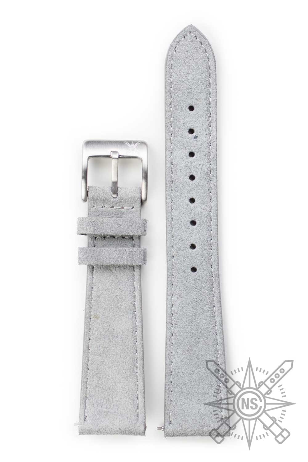 Comparison of suede and leather watch straps on a display.