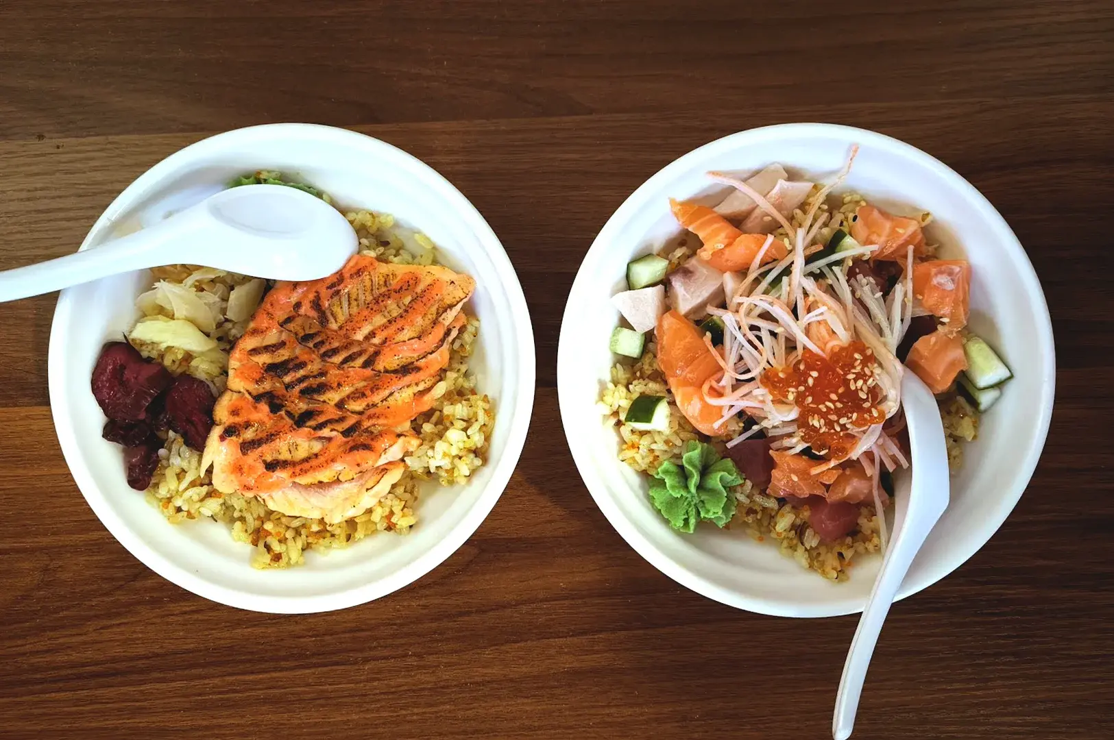 Two bowls of signature chirashi don and truffle rice from Chirashi King Kong at Neuros, highlighting their unique fusion Japanese flavor profile.