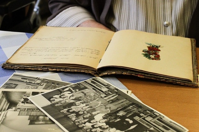 A book with old photographs showcasing inspiration for writing poetry.