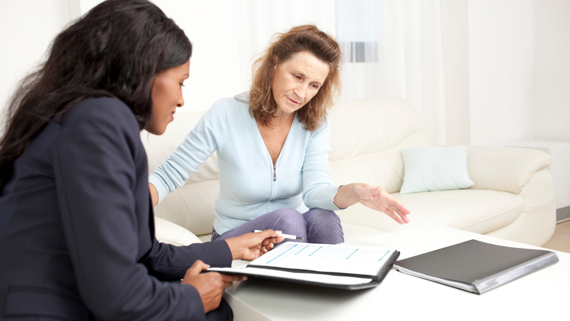 A financial planner helping a couple to create a financial plan that includes short and long-term investments and diversifying their portfolio