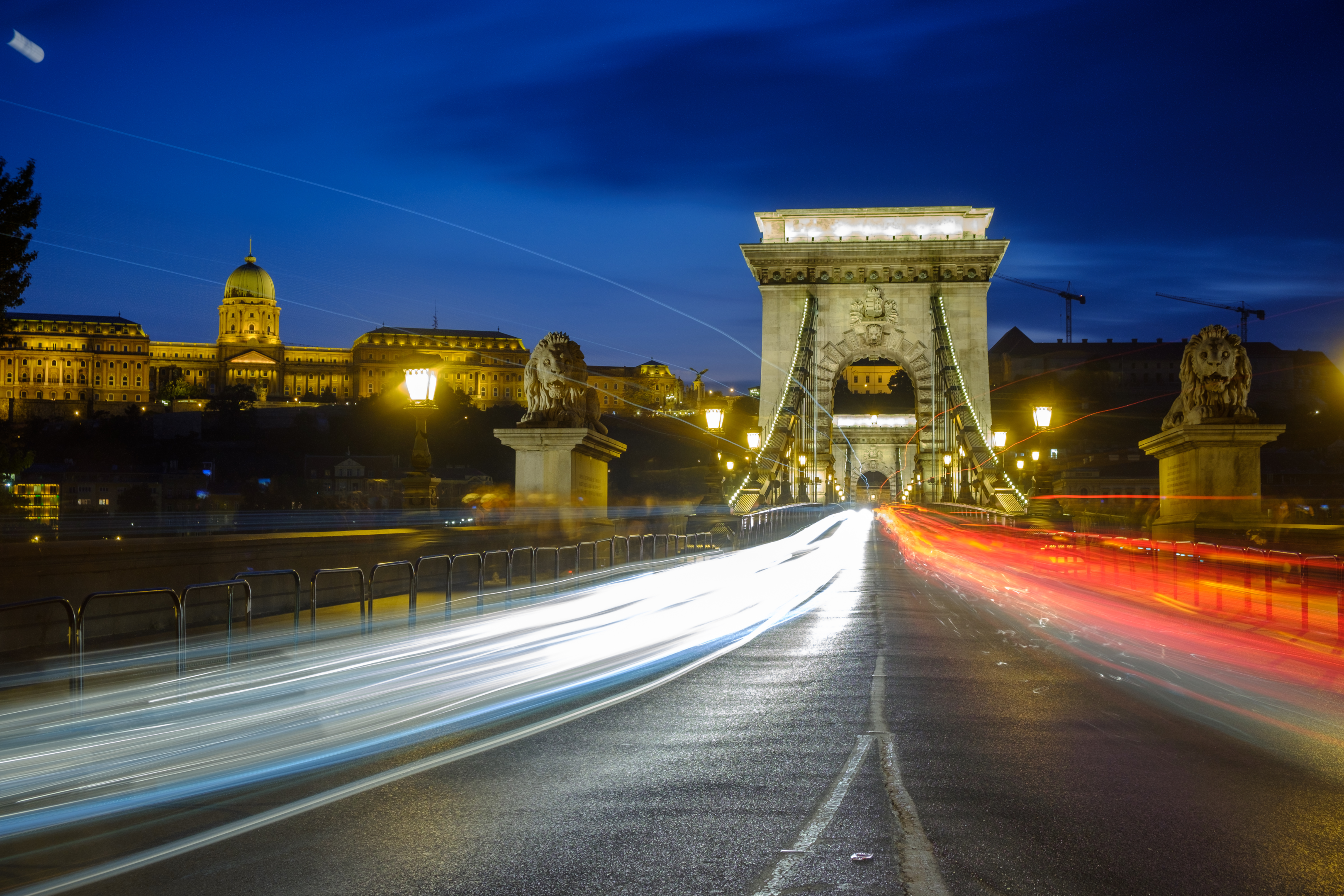 Light trails on the Chain Bridge, Budapest using a slow shutter speed. By Jason Row Photography