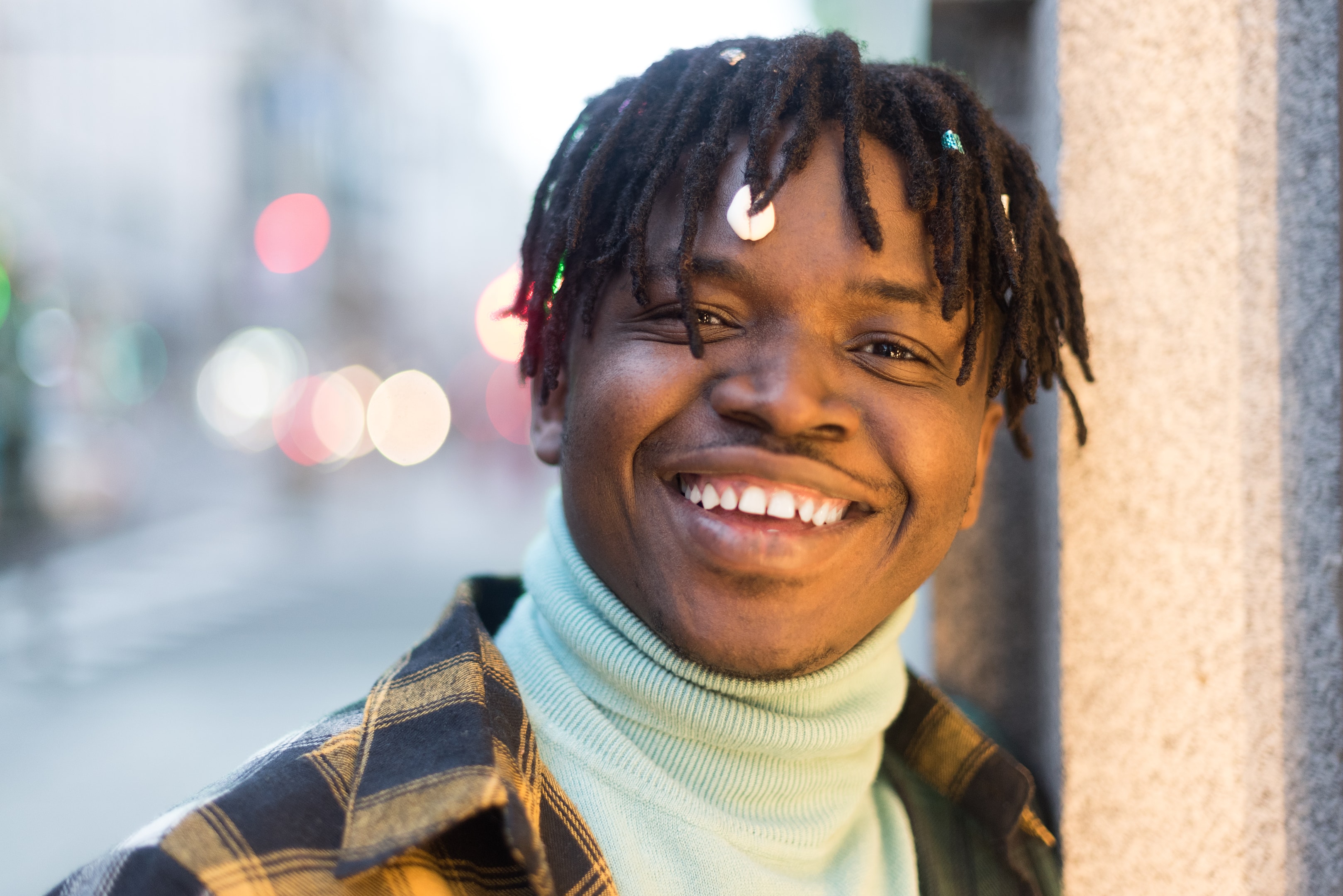 person smiling who has dental implants to improve their oral health