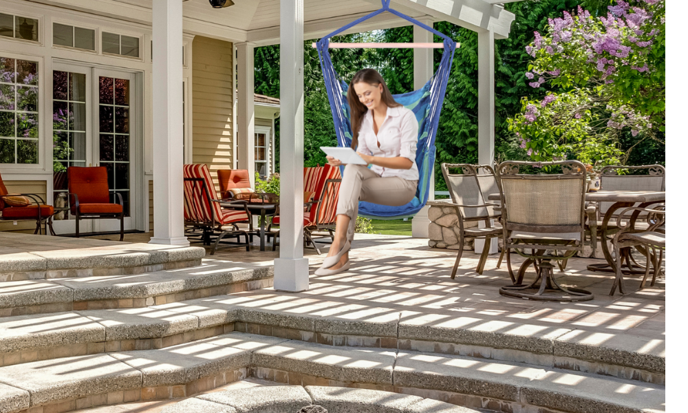 Blue Swing Seats with Person sitting in it on a shady deck