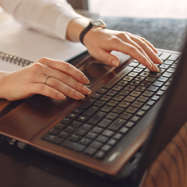 An image of a person using a computer to search for house painters in San Antonio.