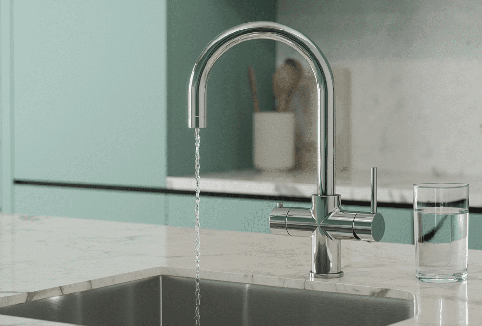 Quantum Chilled instant boiling water tap in a bright kitchen. https://hotwatertaps.ie/product-category/4-in-1-taps-chilled/