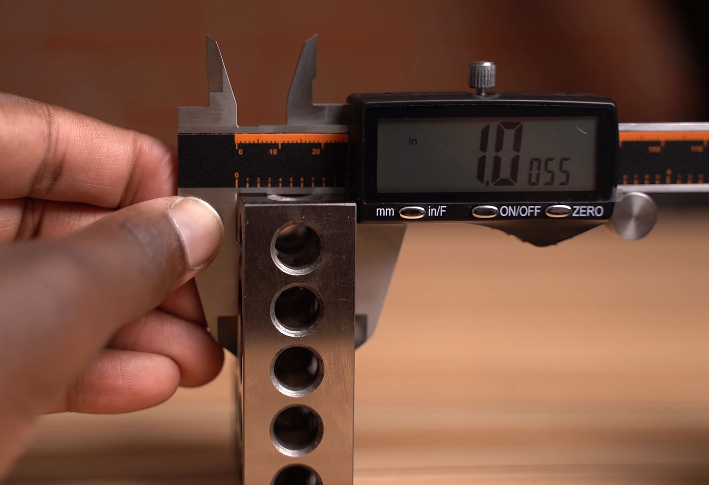 using Hardell digital caliper to measure the outside of a 1 inch block