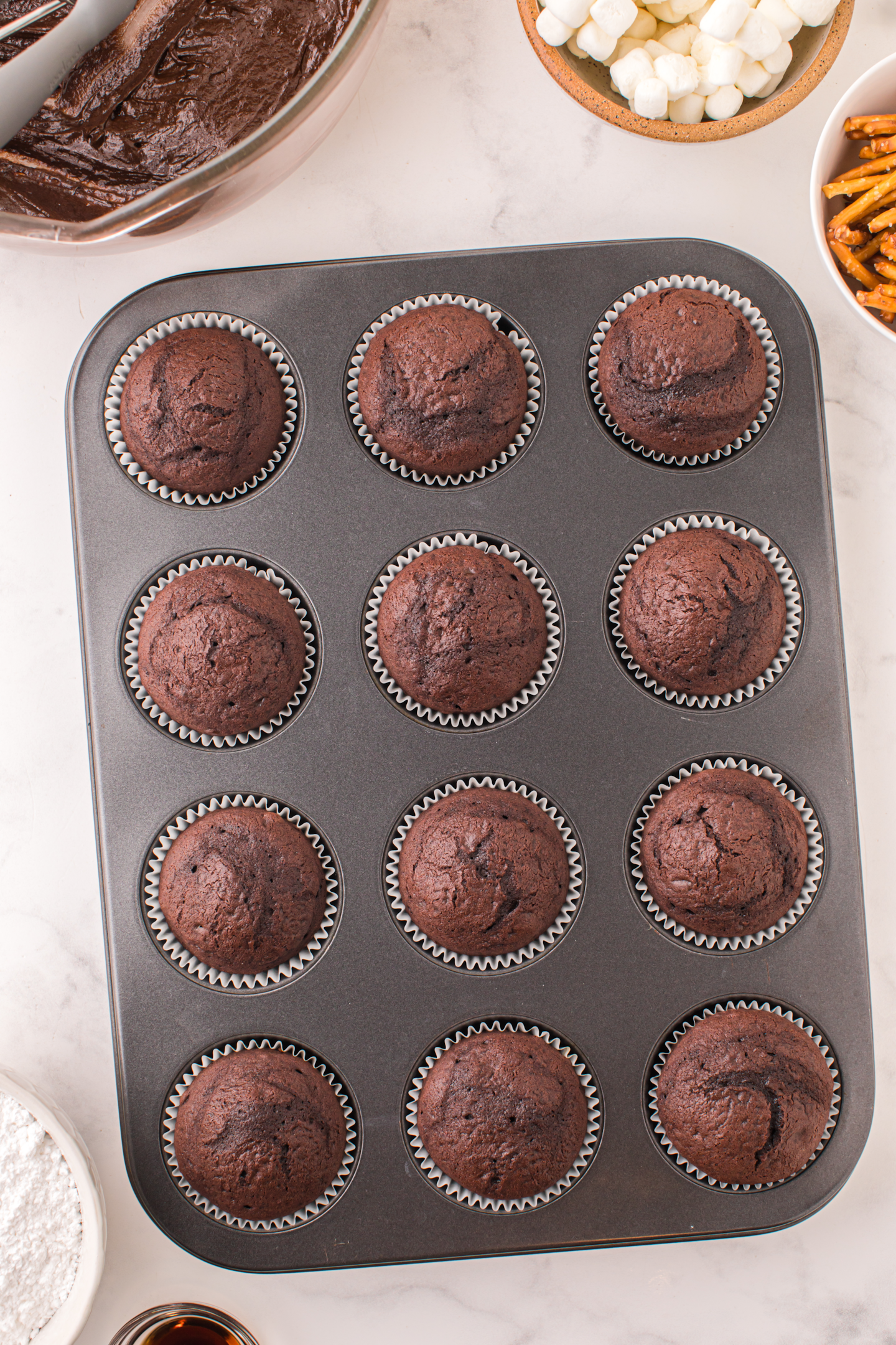 baked chocolate cupcakes in muffin tin