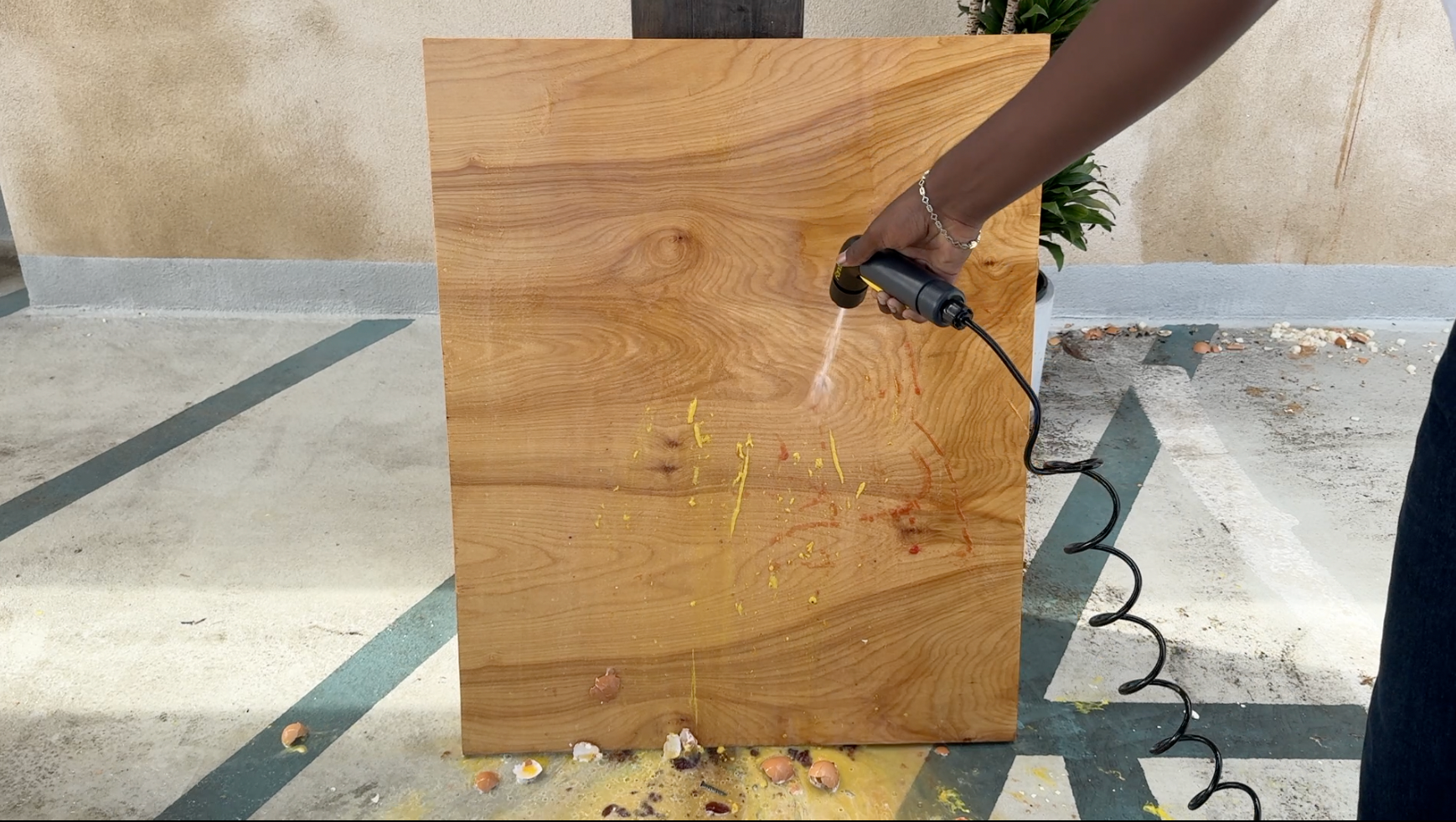 Fanttik NB10 Nano Portable Pressure Washer on wood panels