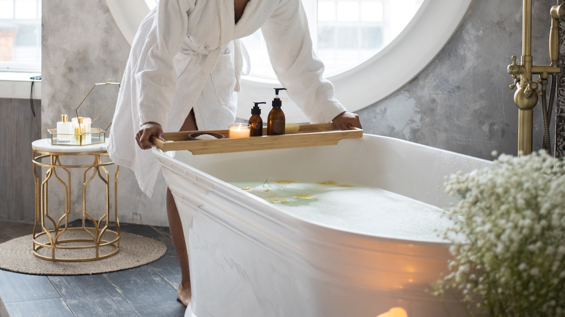 woman preparing a relaxing bath