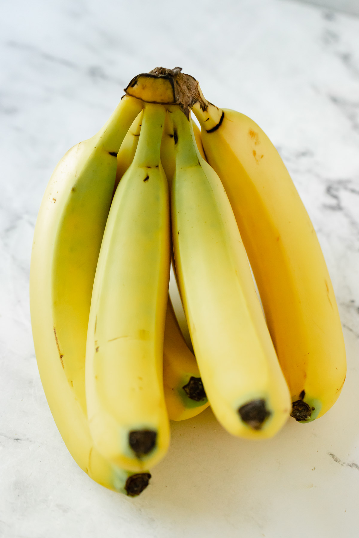 a bunch of unripe bananas