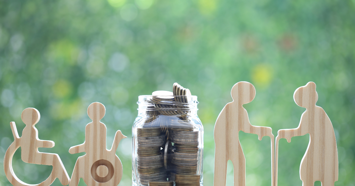 NDIS Housing -A Jar Full Of Coins and Wooden Dummies Of Disable and Old Persons