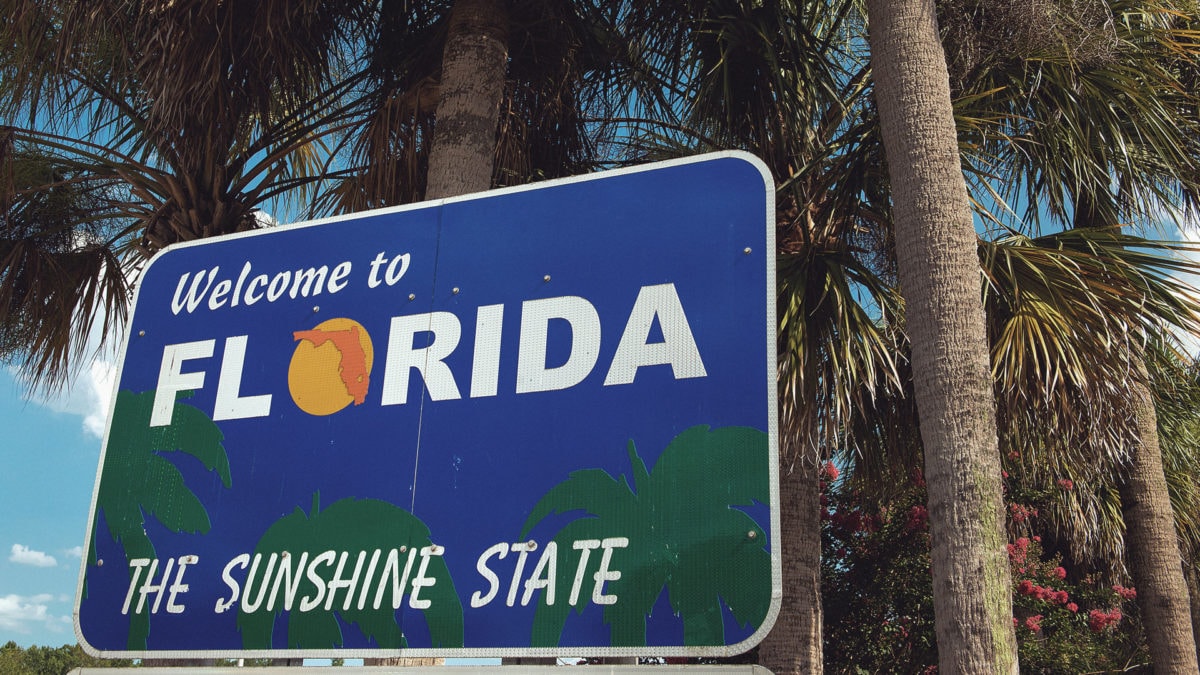 Future of Bitcoin in Florida, represented by a Sunshine state Florida sign.