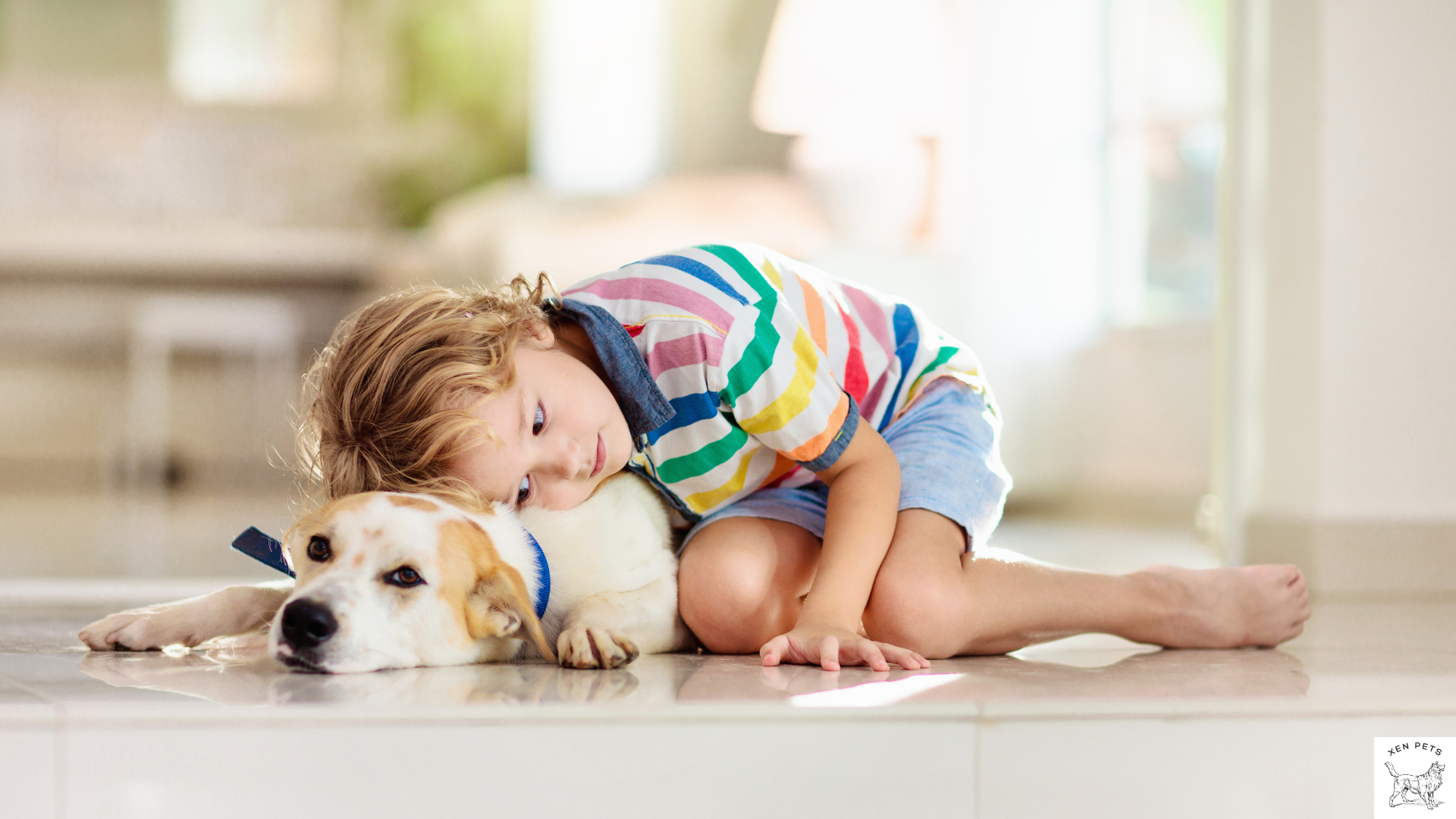 child laying with a dog on the floor