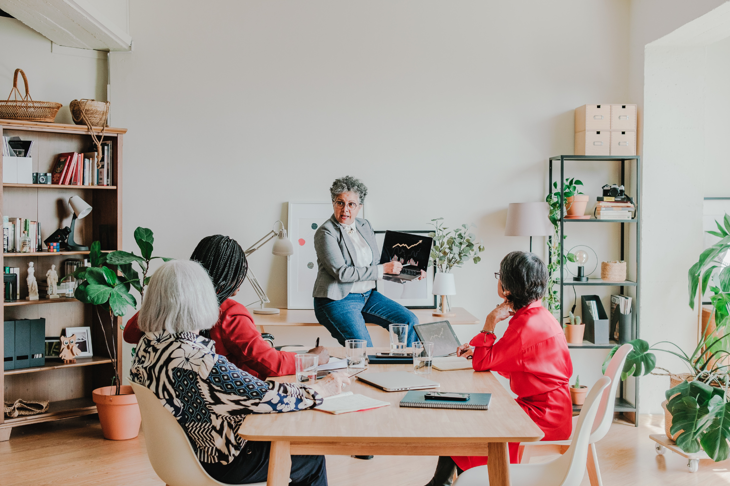 A founder presenting to her employees.