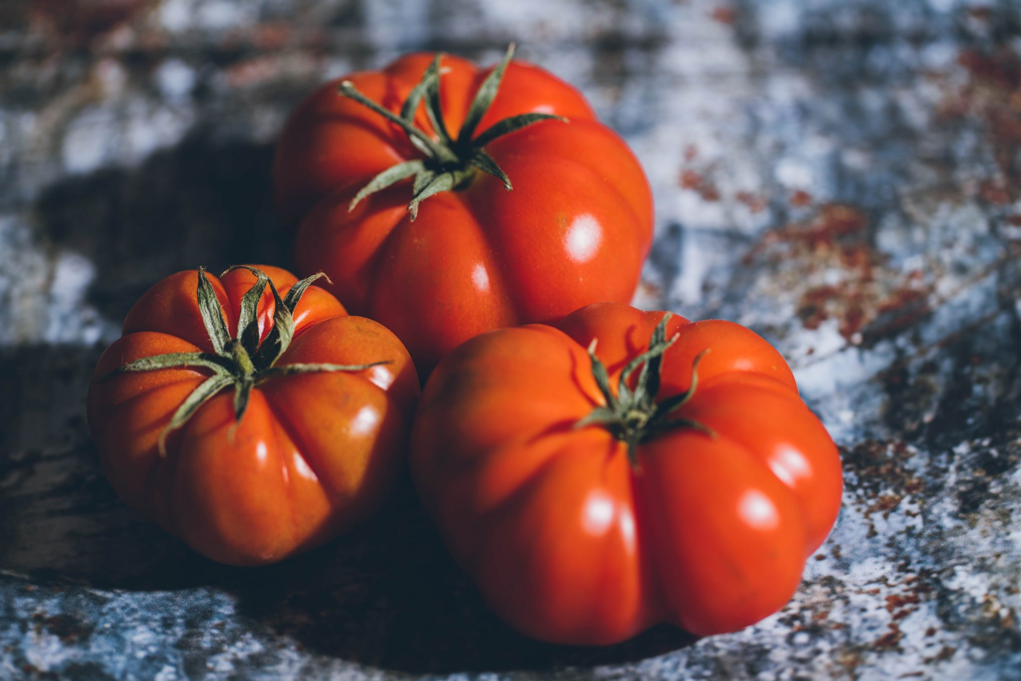 Commercial photo of three tomatoes