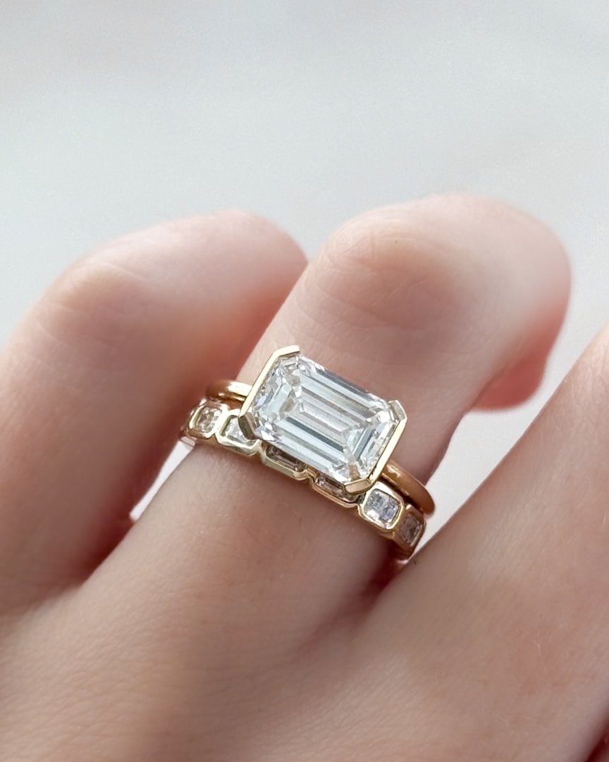 GOODSTONE East West Half Bezel Solitaire Engagement Ring With Emerald Cut Diamond