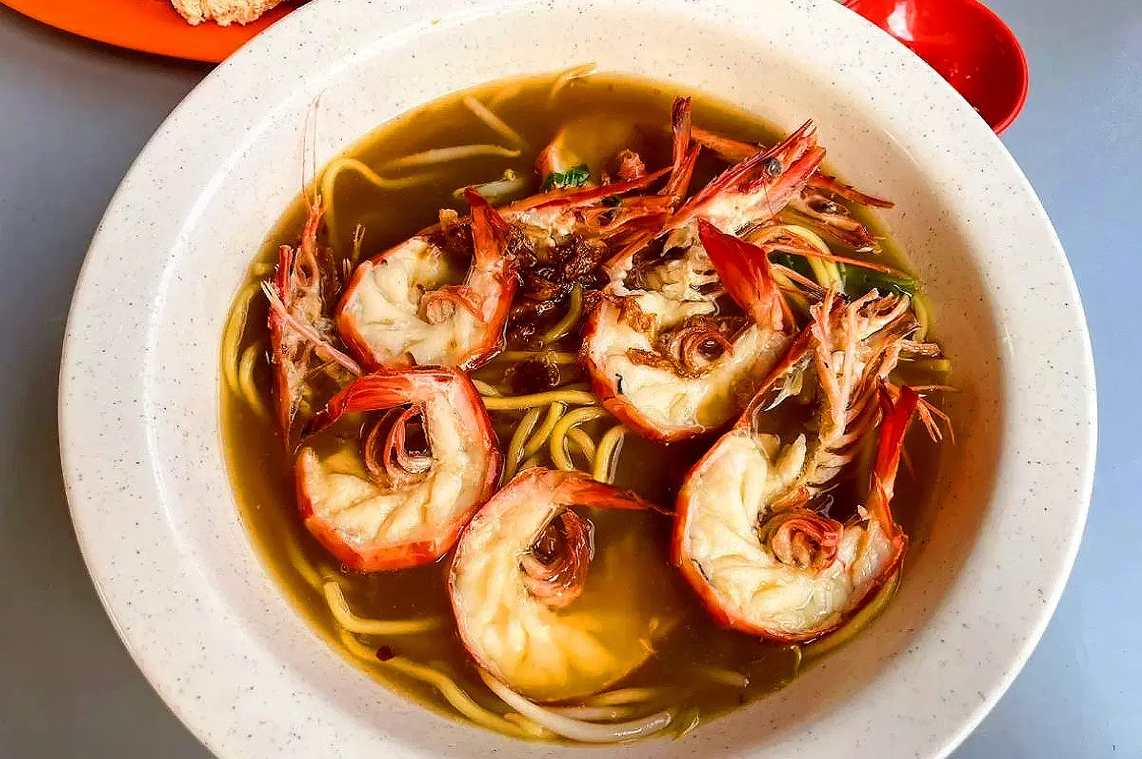 Jalan Sultan Prawn Mee Singapore bowl of traditional prawn mee with whole prawns and savoury broth
