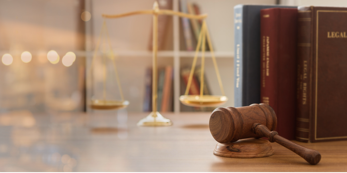 Law books and judge's hammer