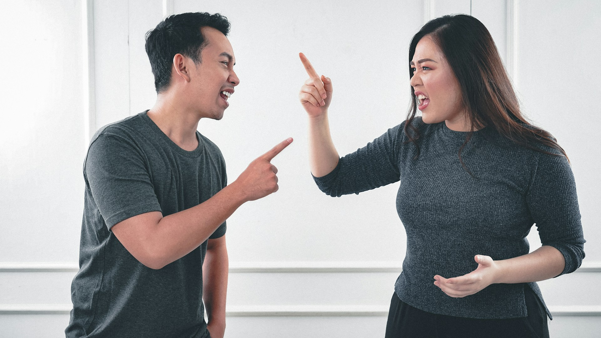 a man and a woman fighting