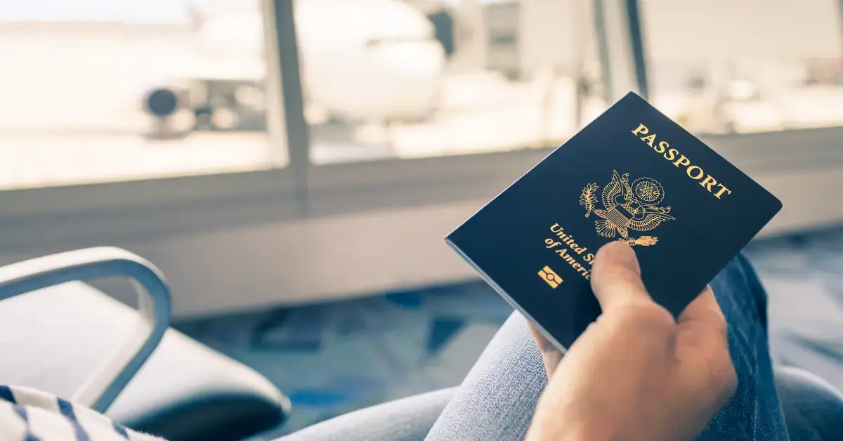 Woman reviewing a CP508C notice beside her passport and tax documents.