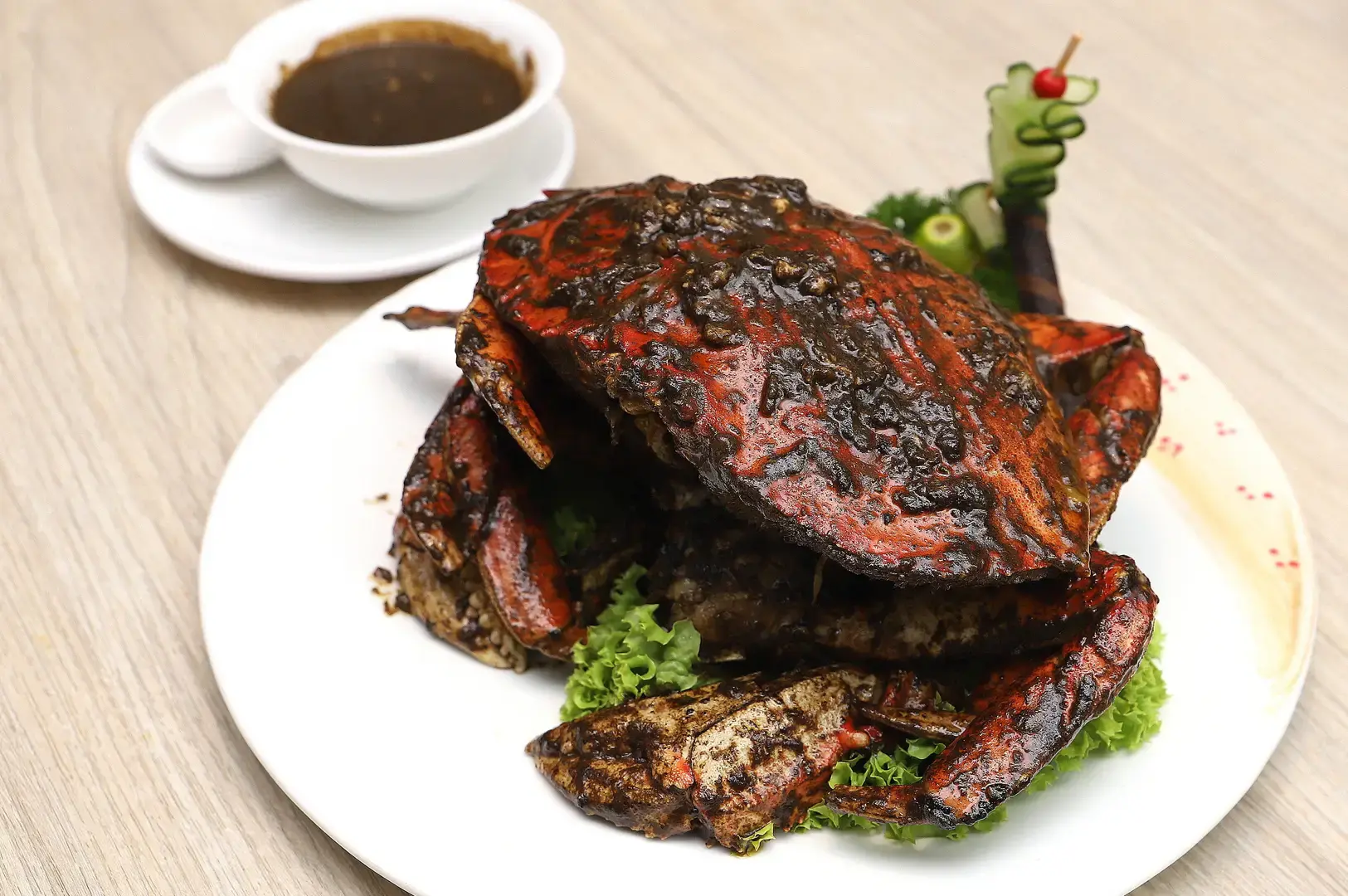 Singapore black pepper crab served with mantou buns and dipping sauce