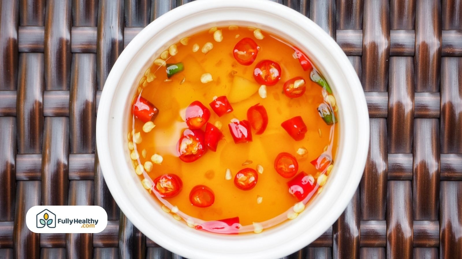 Bowl of chili fish sauce with red peppers