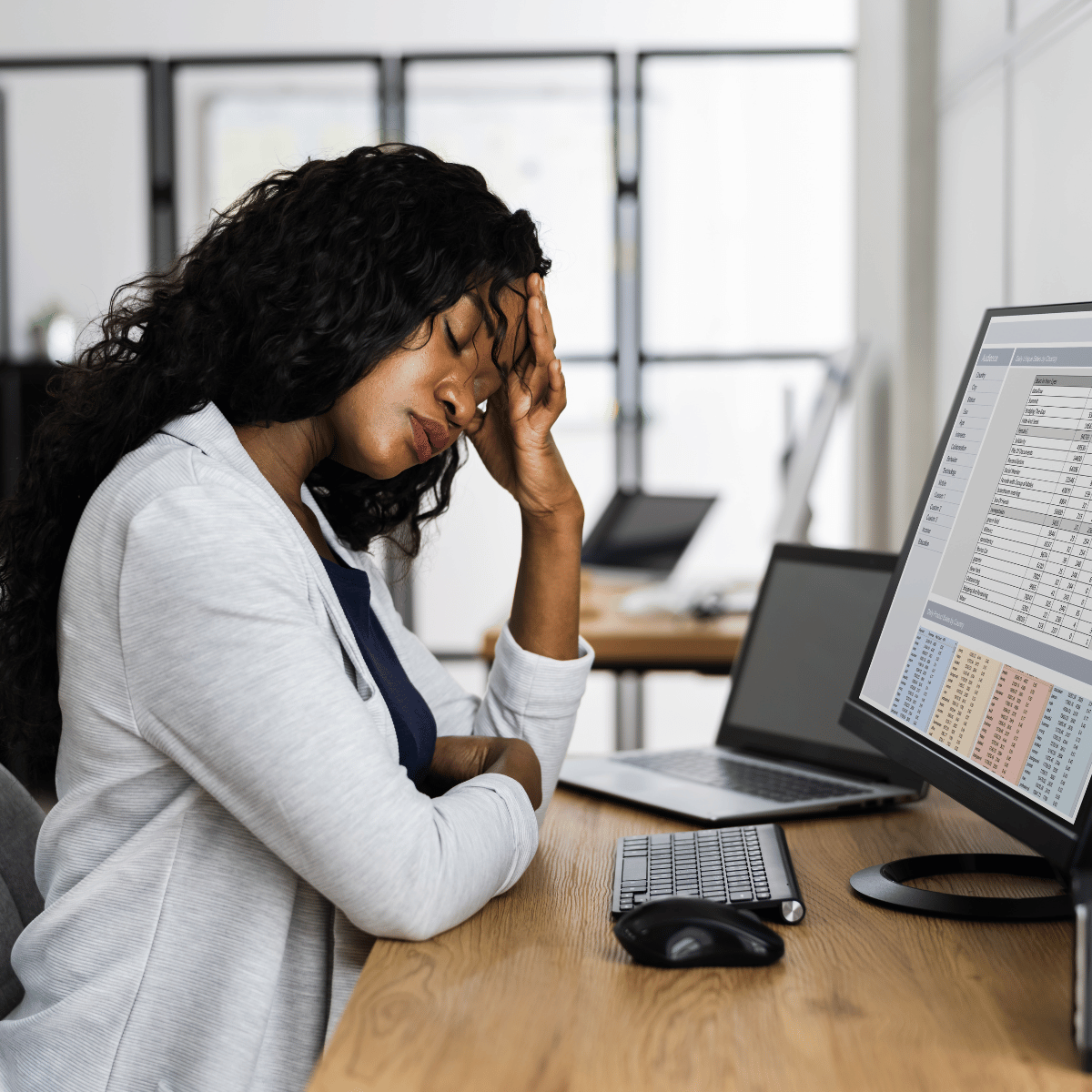 Woman upset at work - Featured In: How To Stop Overthinking After Being Cheated On