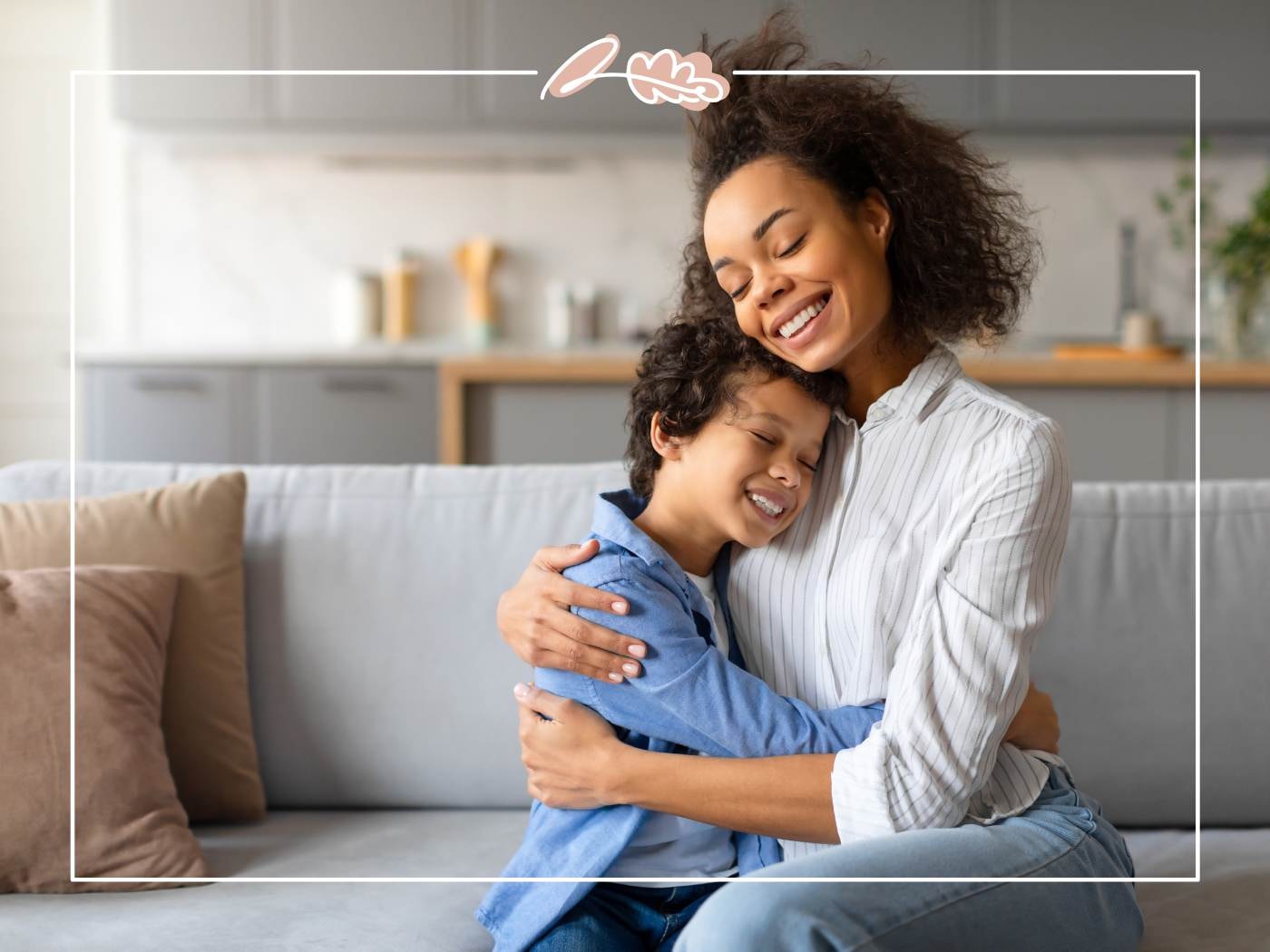 Mother and child hugging on a sofa, expressing warmth and connection.